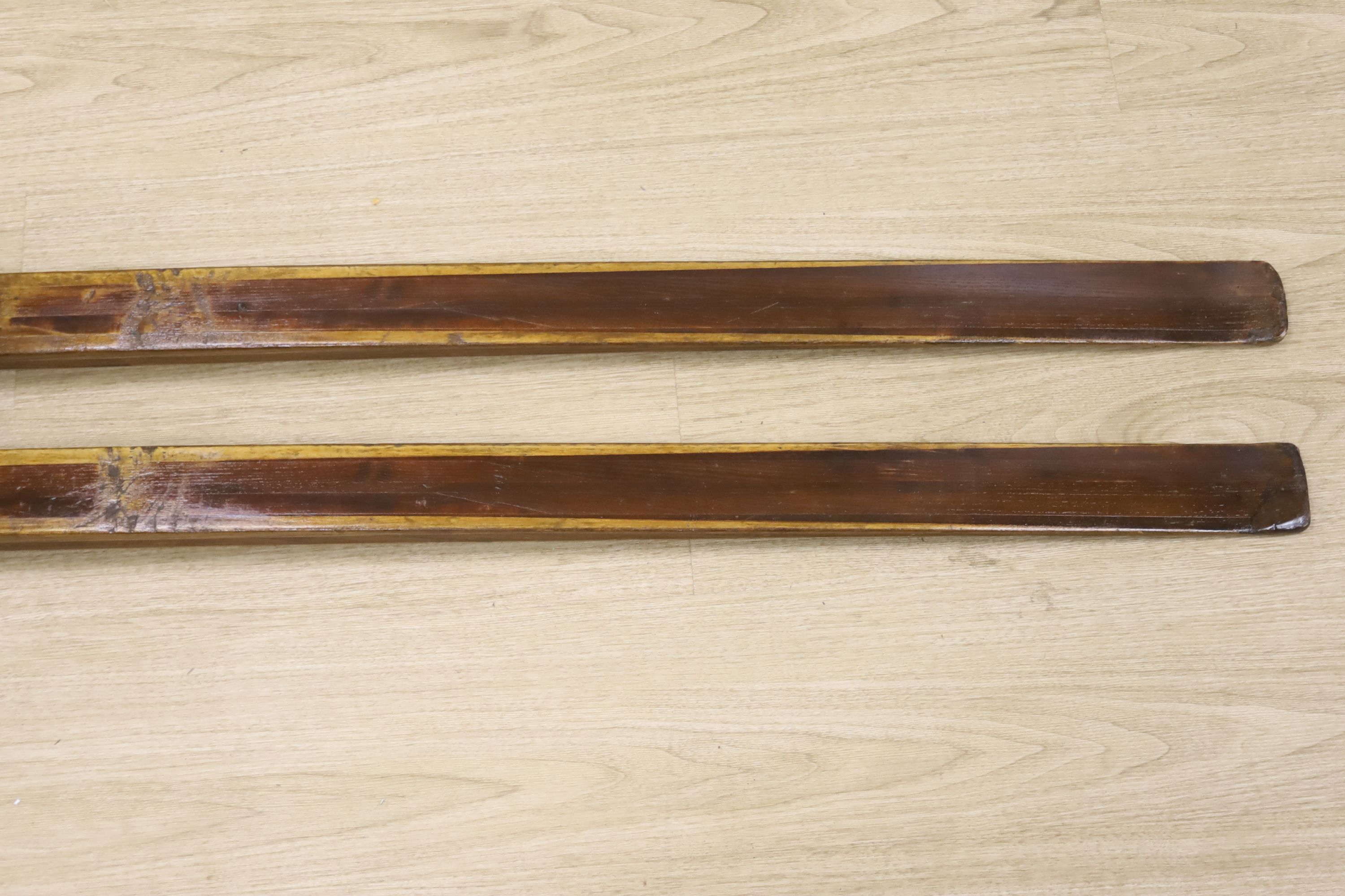 A pair of vintage wood skis, length 210cm